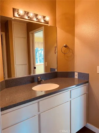 a view of a yard with wooden fence