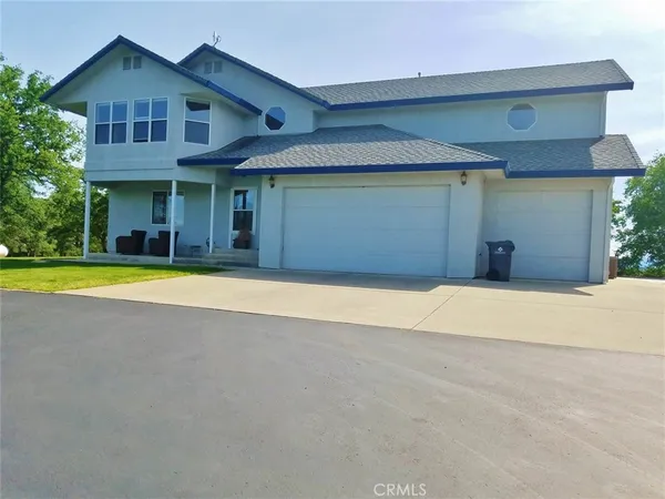 a view of a house with swimming pool and porch