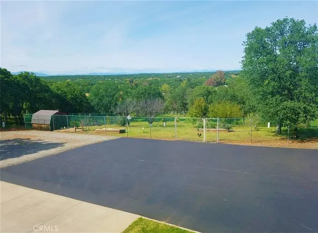 a view of a swimming pool and a yard