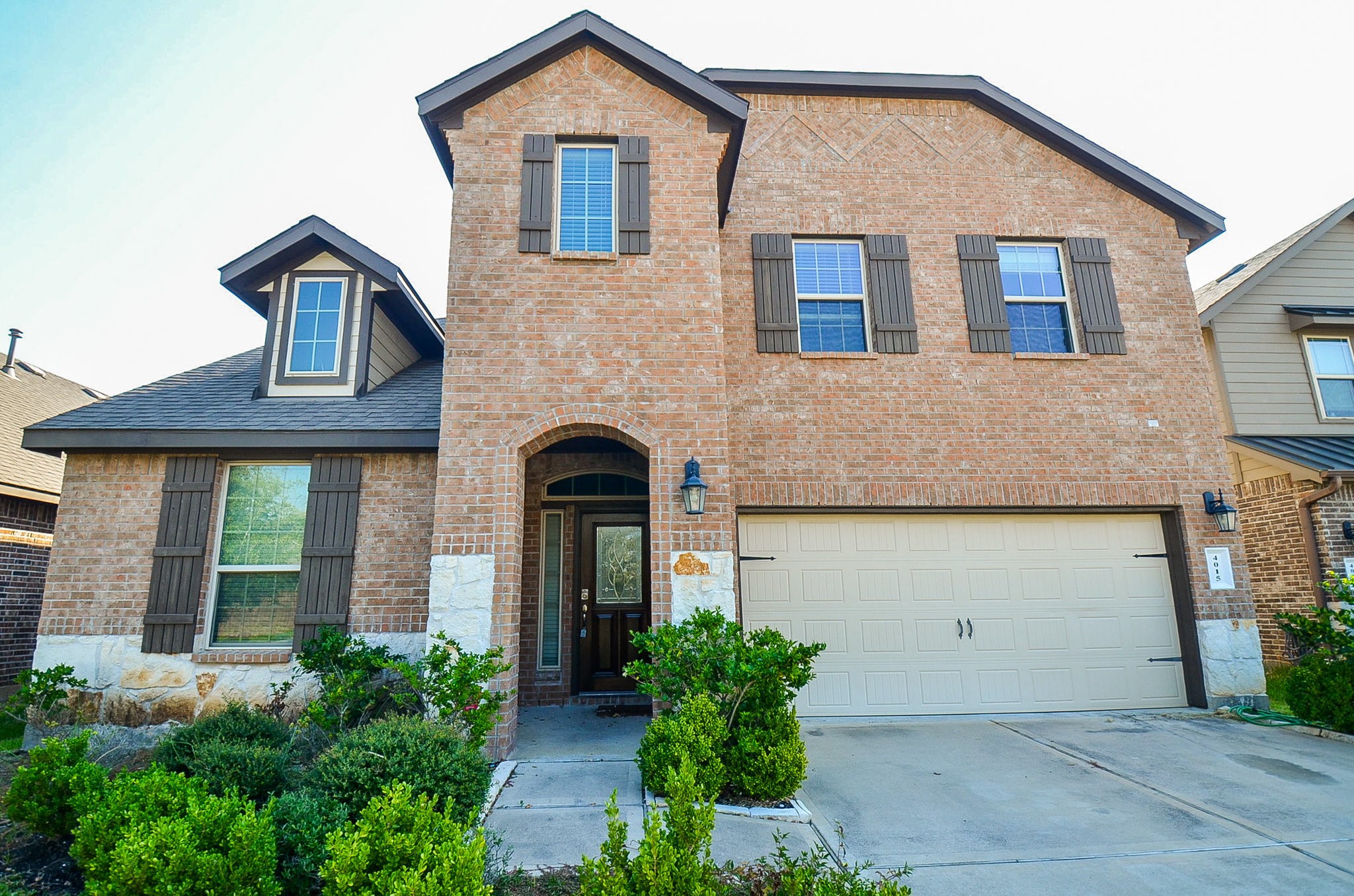 4015 Prairie Landing Lane Katy, TX 77494 - Photo 1 of 32 a front view of a house with garden