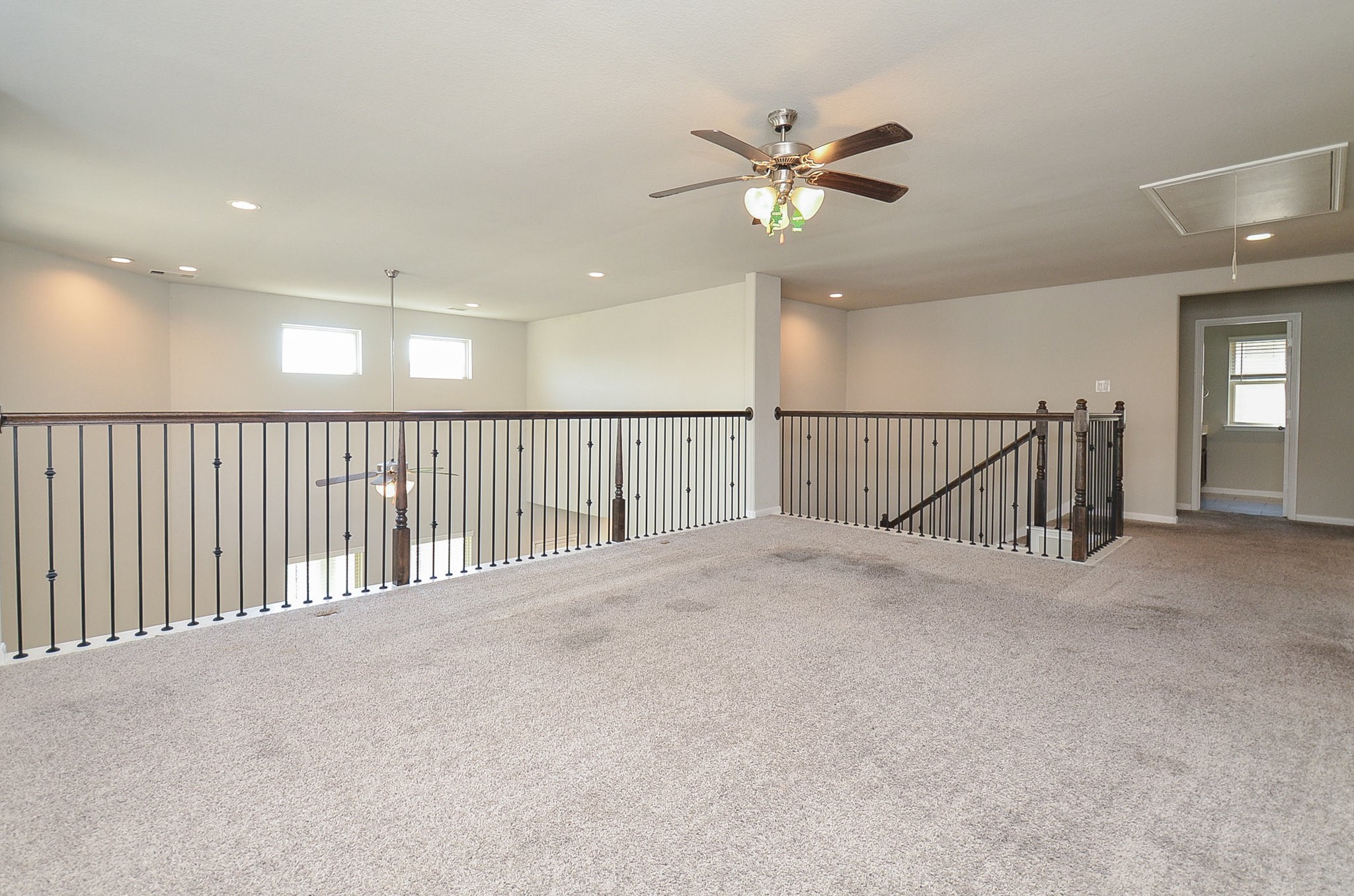 4015 Prairie Landing Lane Katy, TX 77494 - Photo 15 of 32 a view of a hallway with a ceiling fan