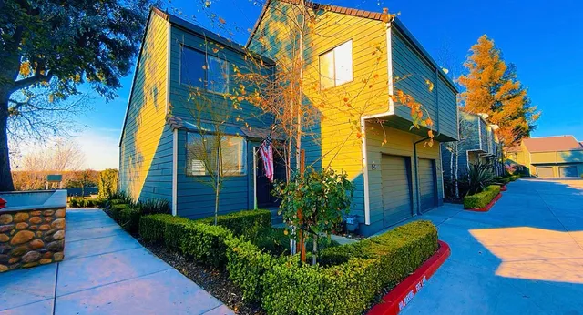 a view of a building with a yard