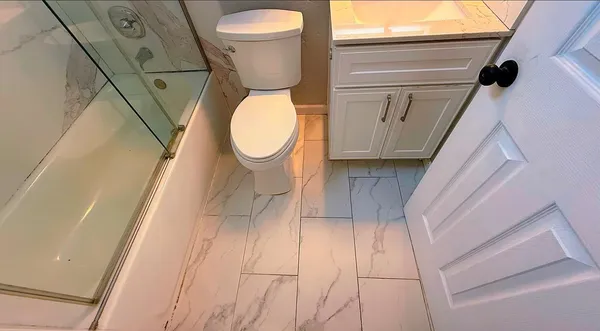 a bathroom with a toilet and a sink
