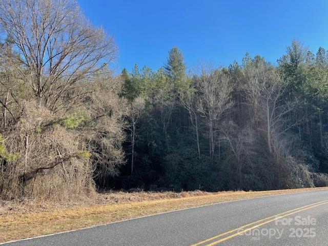 1140 Hidden Valley Road Taylorsville, NC 28681 - Photo 2 of 4 a view of a yard covered with snow in front of house