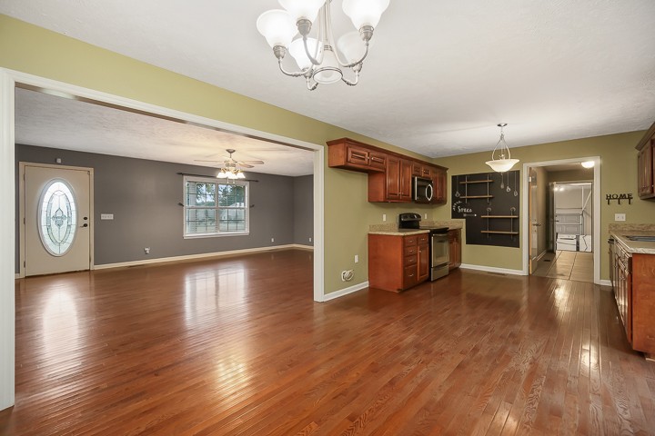 372 Bell Road Morrison, TN 37357 - Photo 14 of 46 a kitchen with stainless steel appliances wooden floor and a refrigerator