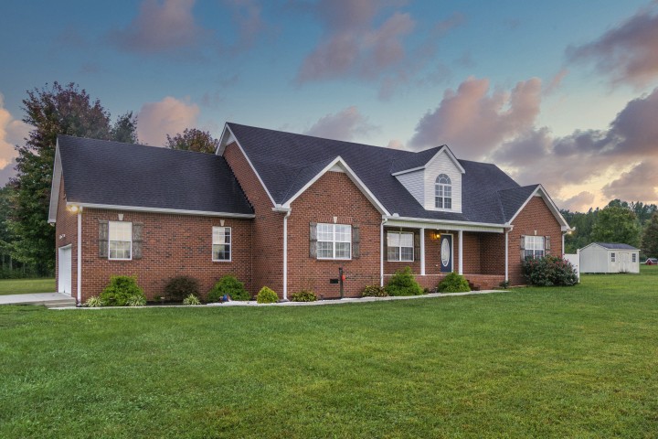 372 Bell Road Morrison, TN 37357 - Photo 3 of 46 a front view of a house with a garden and plants