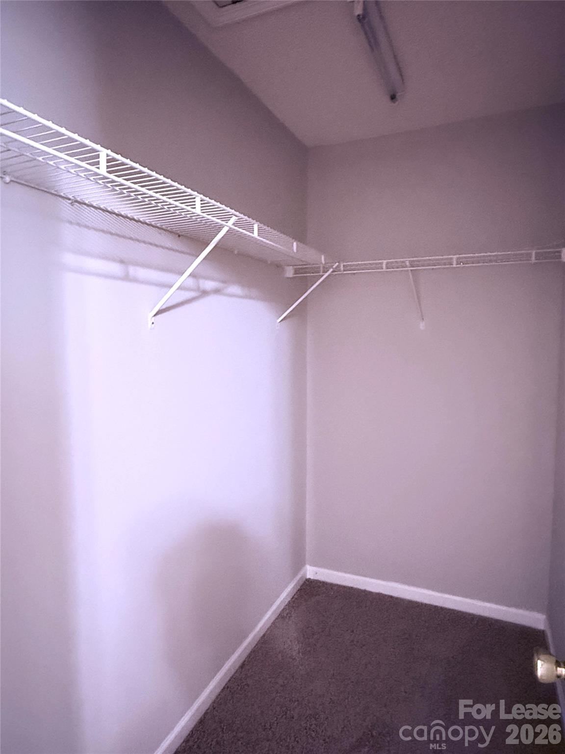 11519 Retriever Way Charlotte, NC 28269 - Photo 11 of 11 a view of a room with racks on the wall