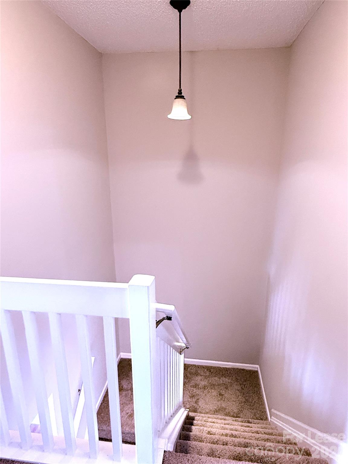 11519 Retriever Way Charlotte, NC 28269 - Photo 7 of 11 a view of a livingroom with wooden floor and a ceiling fan