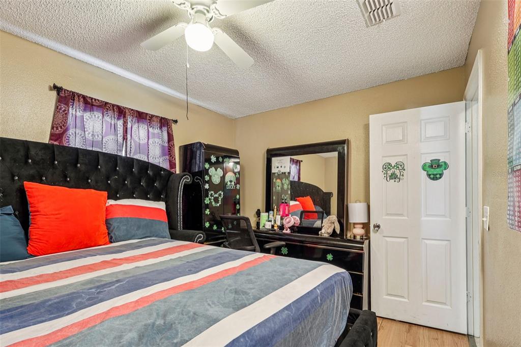 42 Inconnu Drive Poinciana, FL 34759 - Photo 20 of 29 a bedroom with bed and window