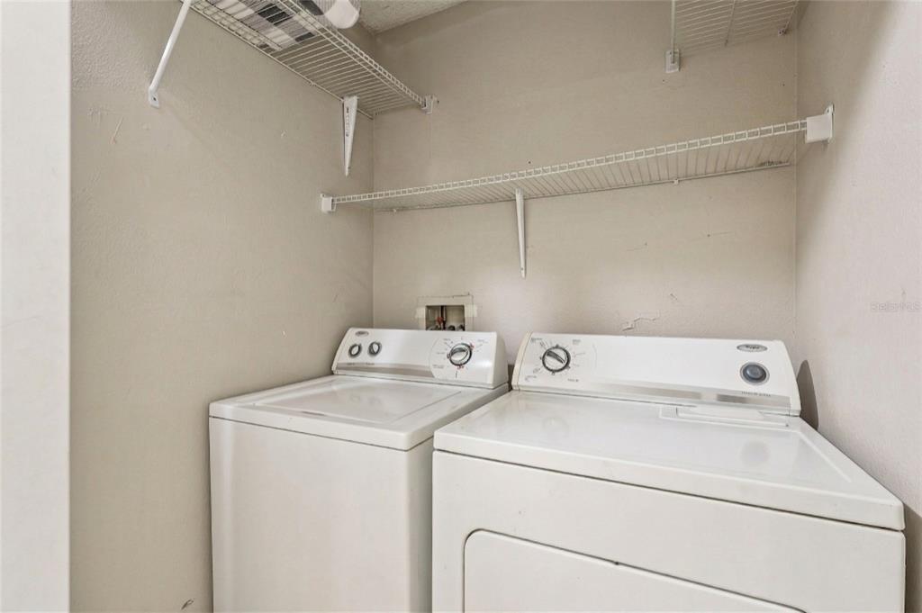 42 Inconnu Drive Poinciana, FL 34759 - Photo 25 of 29 a utility room with dryer and washer