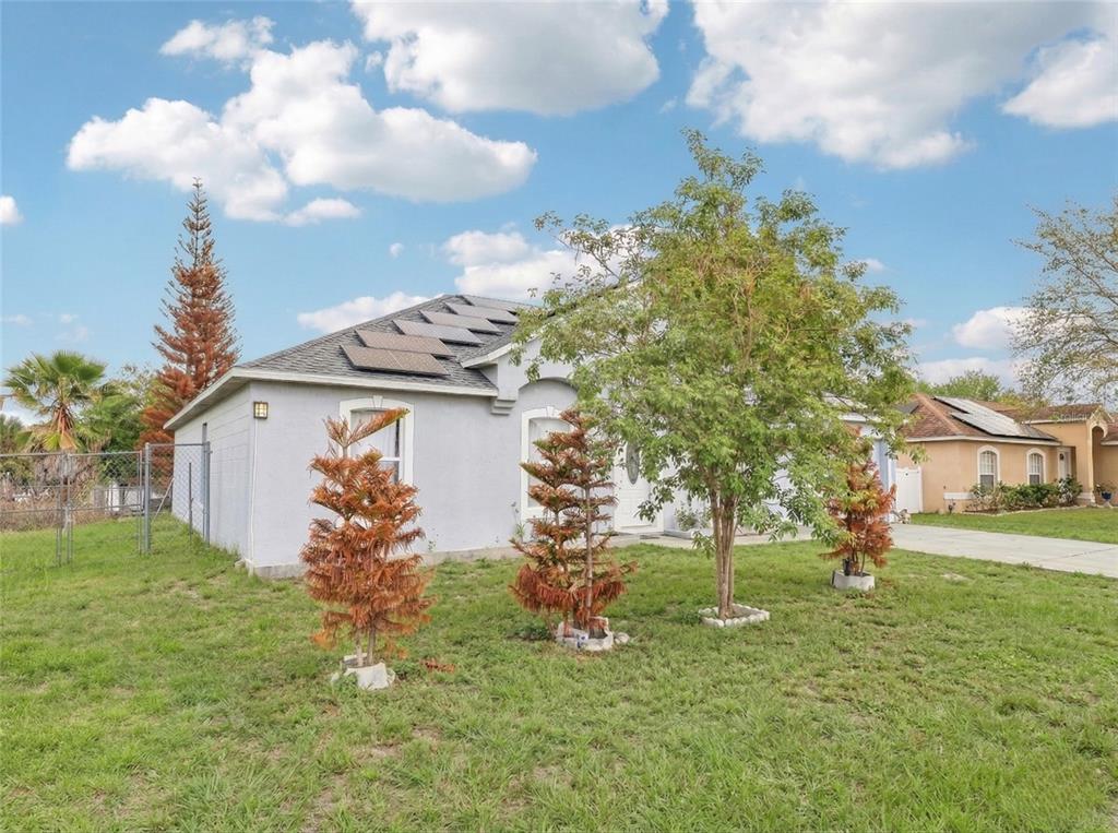 42 Inconnu Drive Poinciana, FL 34759 - Photo 5 of 29 a view of a house with a yard