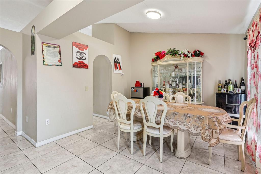 42 Inconnu Drive Poinciana, FL 34759 - Photo 8 of 29 a view of a dining room with furniture