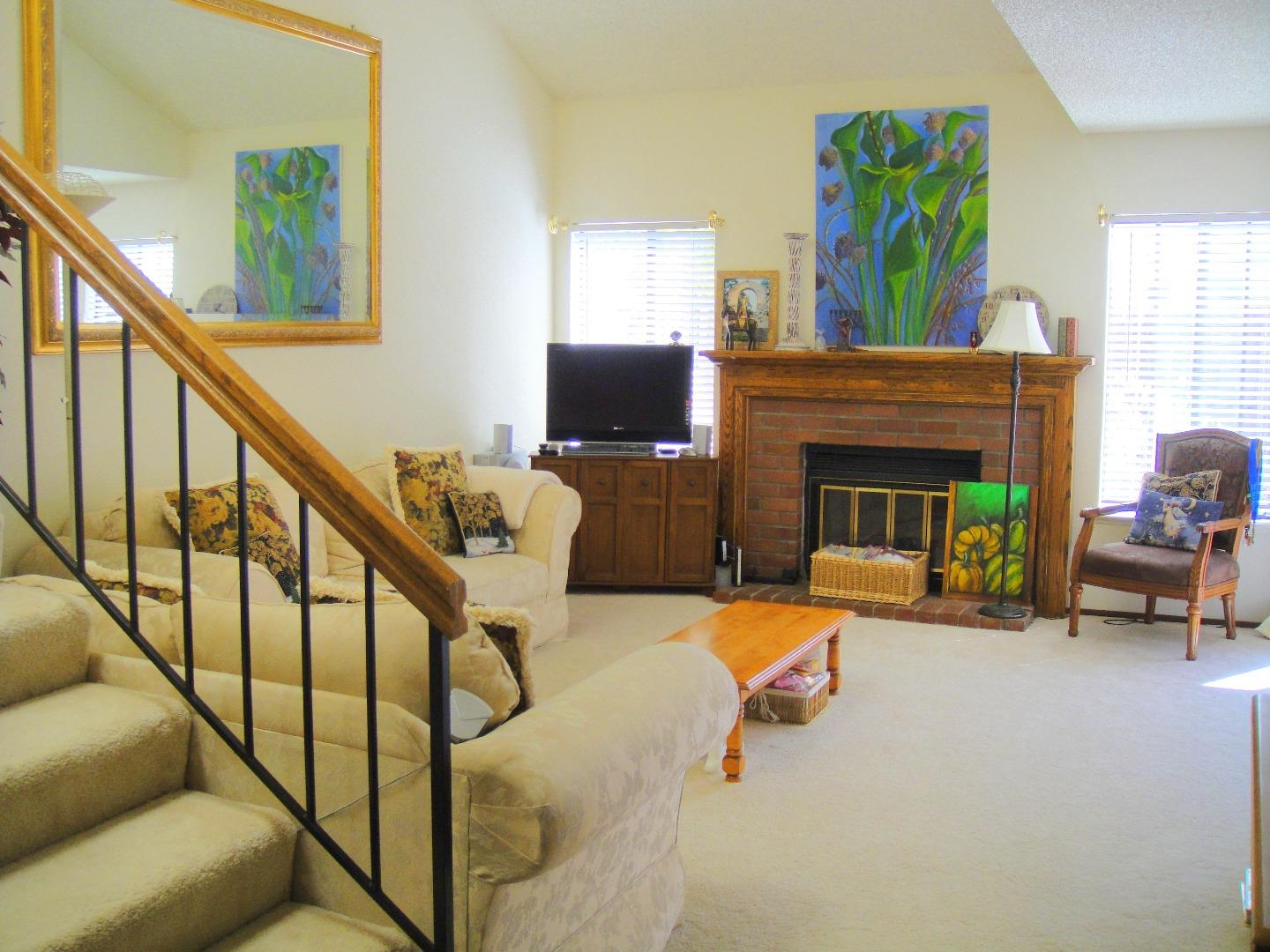 752 Superior Road Milpitas, CA 95035 - Photo 2 of 14 a living room with furniture and a fireplace