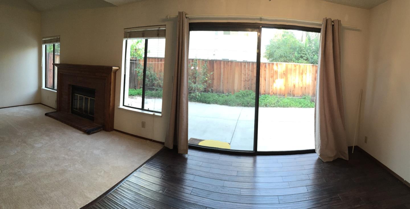 752 Superior Road Milpitas, CA 95035 - Photo 6 of 14 a view of an empty room with wooden floor and a window