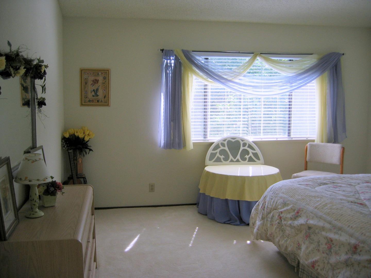 752 Superior Road Milpitas, CA 95035 - Photo 8 of 14 a bedroom with a bed and a table