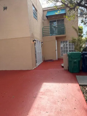 a view of a backyard of the house