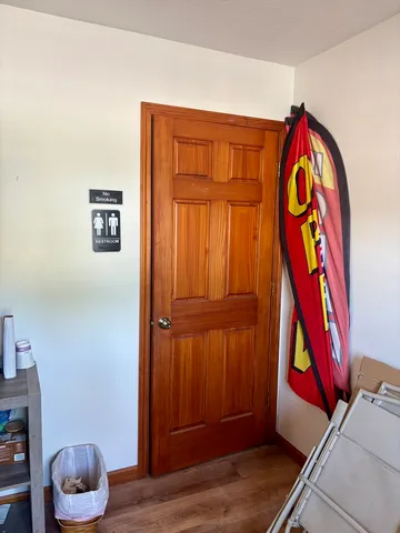 a room with musical instruments and wooden floor