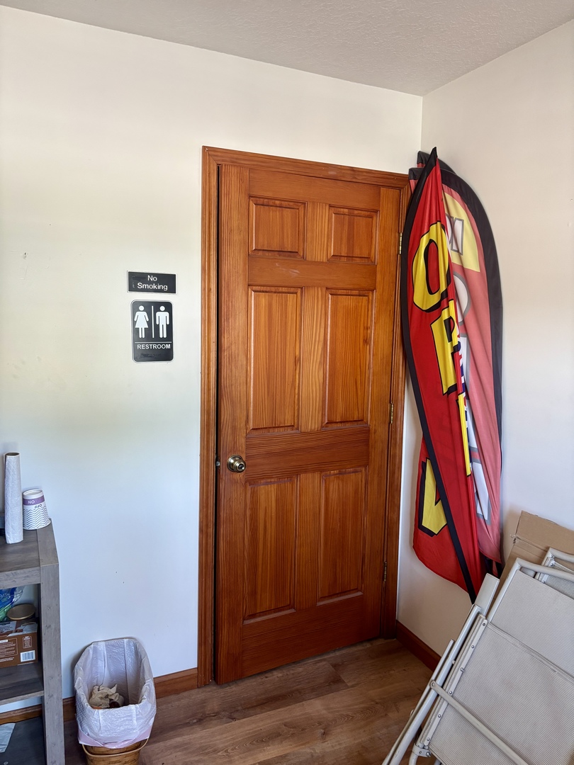 922 Highway 49 Casey, IL 62420 - Photo 15 of 28 a room with musical instruments and wooden floor