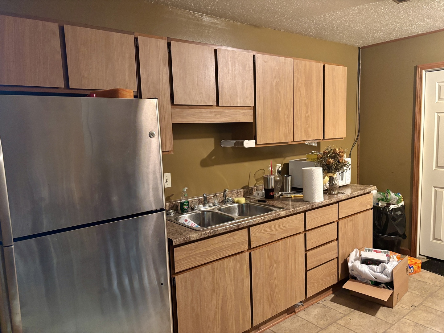 922 Highway 49 Casey, IL 62420 - Photo 18 of 28 a kitchen with stainless steel appliances granite countertop a refrigerator sink and cabinets