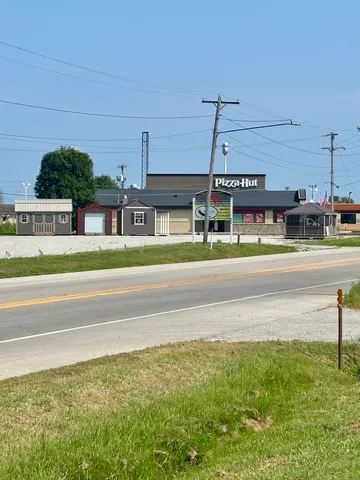 a view of building with an outdoor space and seating area