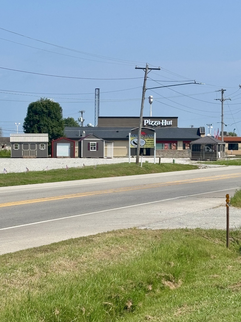 922 Highway 49 Casey, IL 62420 - Photo 26 of 28 a view of building with an outdoor space and seating area