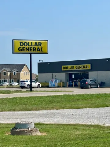 a view of a swimming pool and a yard
