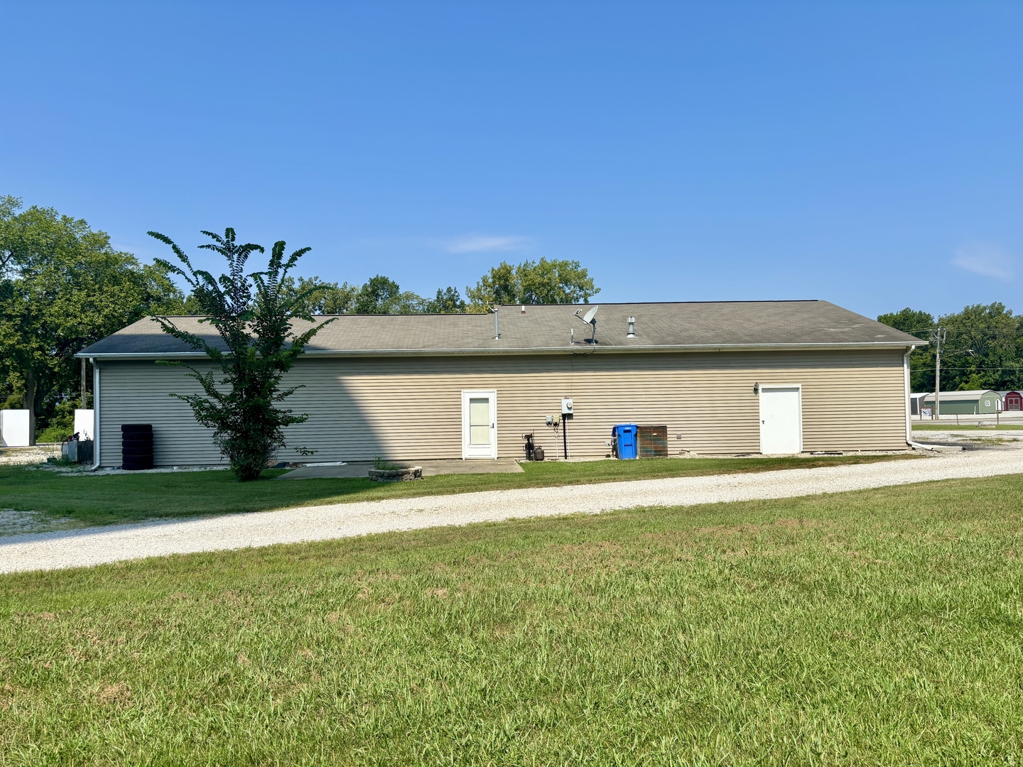 922 Highway 49 Casey, IL 62420 - Photo 6 of 28 a view of a house with a yard and a large tree