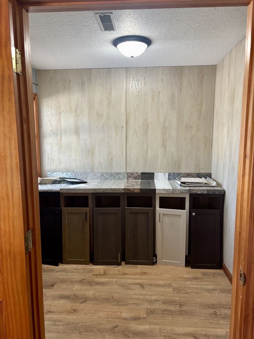 922 Highway 49 Casey, IL 62420 - Photo 10 of 28 a view of a kitchen with stainless steel appliances granite countertop a stove and a refrigerator