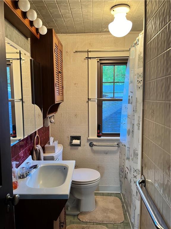 124 Pine Hill Road Kittanning, PA 16201 - Photo 11 of 20 a bathroom with a sink toilet and shower