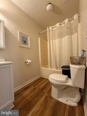 a bathroom with a toilet a sink and a shower