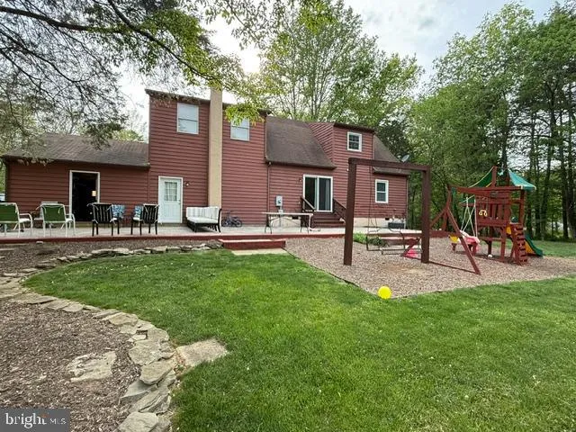 a house view with a sitting space and garden