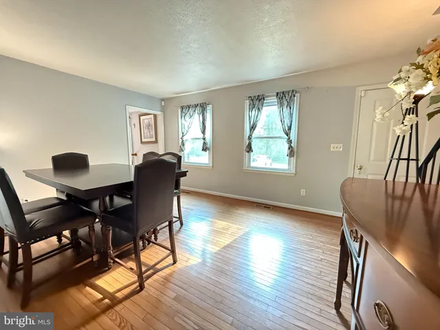 a view of a livingroom with furniture and a window