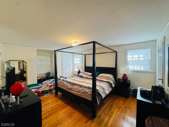 a bathroom with a sink vanity mirror and toilet