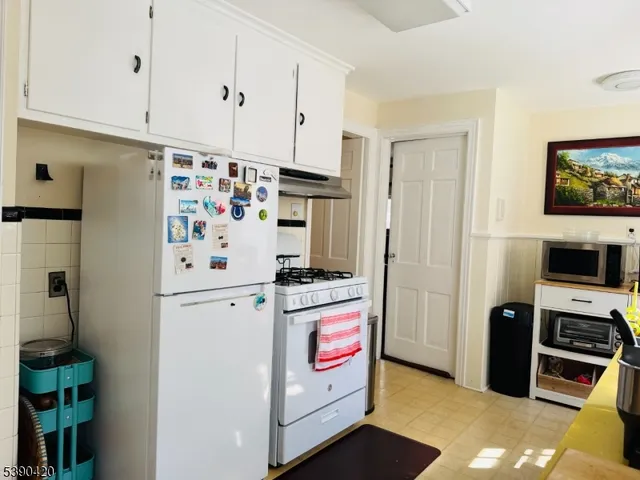 a kitchen with stainless steel appliances a refrigerator a stove and a sink