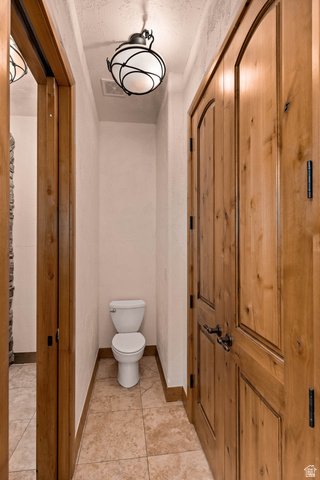 2464 East Granite Way St. George, UT 84790 - Photo 65 of 106 Full bathroom with light tile patterned floors and a textured ceiling