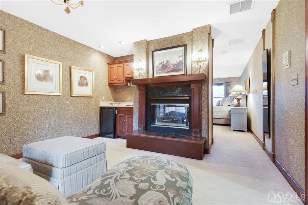 270 Springhill Road Skillman, NJ 08558 - Photo 13 of 27 a bedroom with a bed and a fireplace