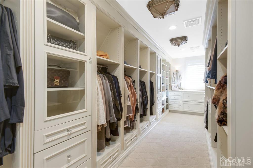 270 Springhill Road Skillman, NJ 08558 - Photo 14 of 27 a view of walk in closet with clothes and shoes