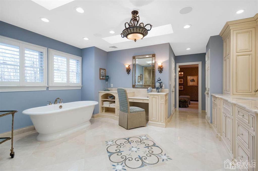 270 Springhill Road Skillman, NJ 08558 - Photo 15 of 27 a spacious bathroom with a sink mirror and a bathtub