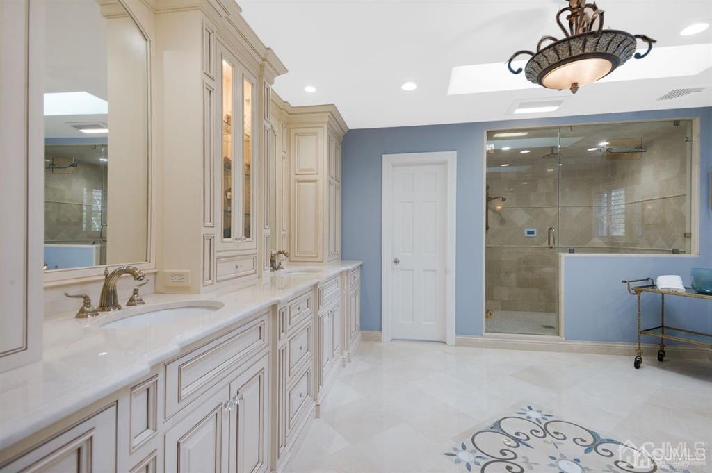 270 Springhill Road Skillman, NJ 08558 - Photo 16 of 27 a bathroom with a sink and a mirror