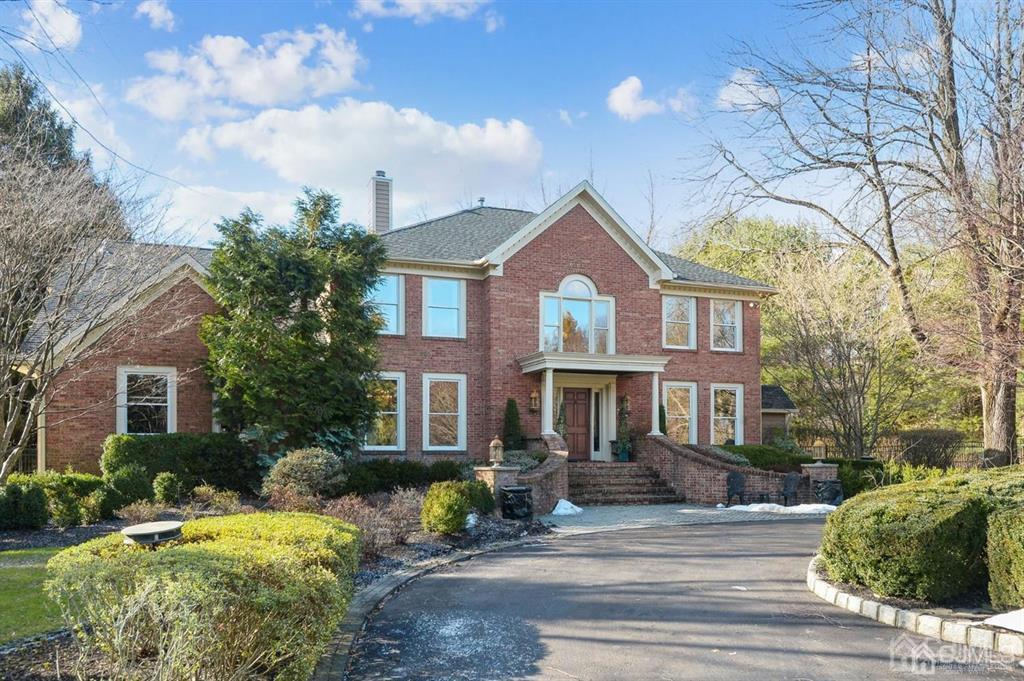 270 Springhill Road Skillman, NJ 08558 - Photo 2 of 27 a front view of a house with a garden