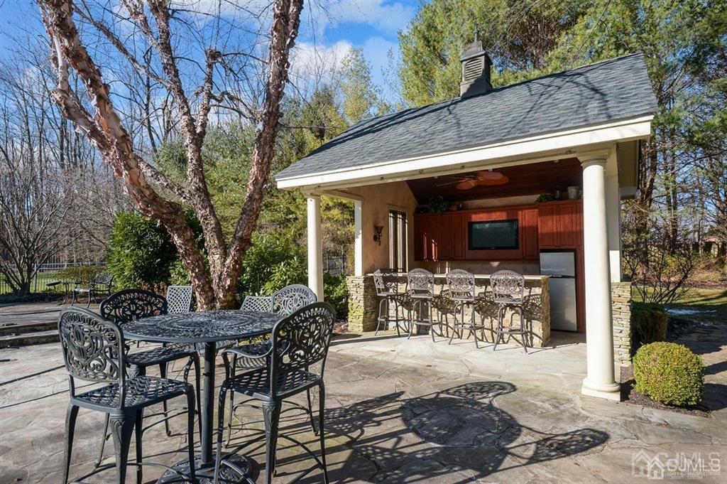 270 Springhill Road Skillman, NJ 08558 - Photo 25 of 27 a view of a patio with table and chairs and potted plants