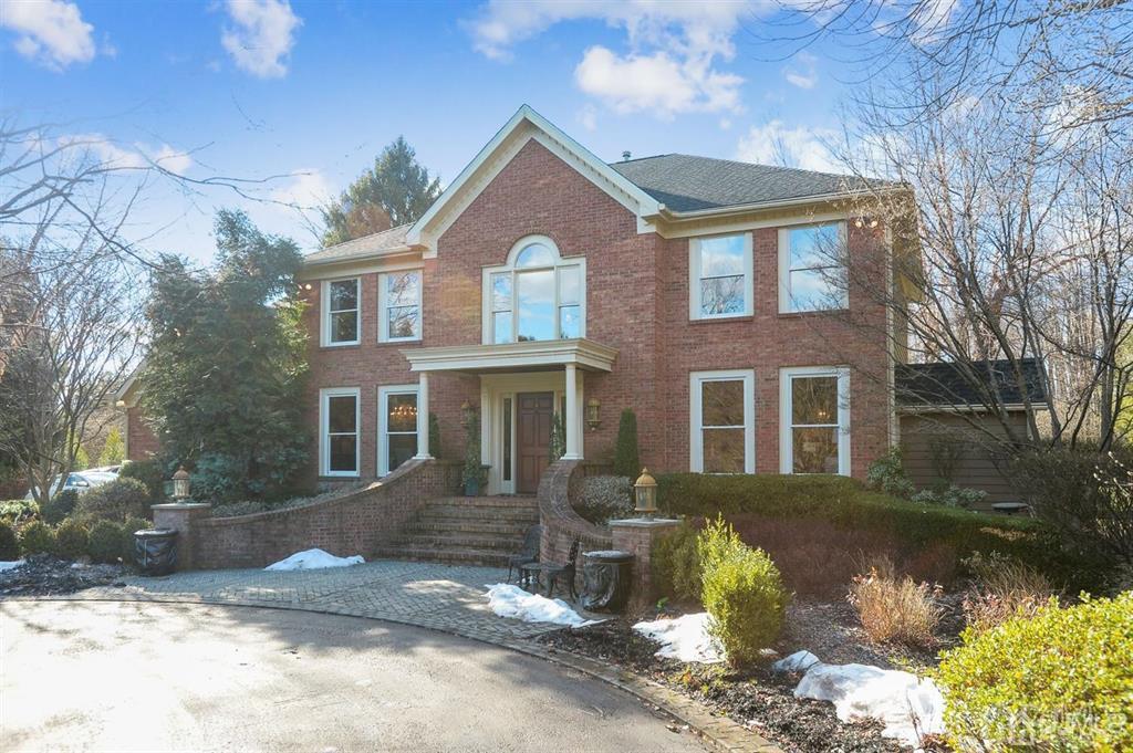 270 Springhill Road Skillman, NJ 08558 - Photo 3 of 27 a front view of a house with a yard garage and outdoor seating