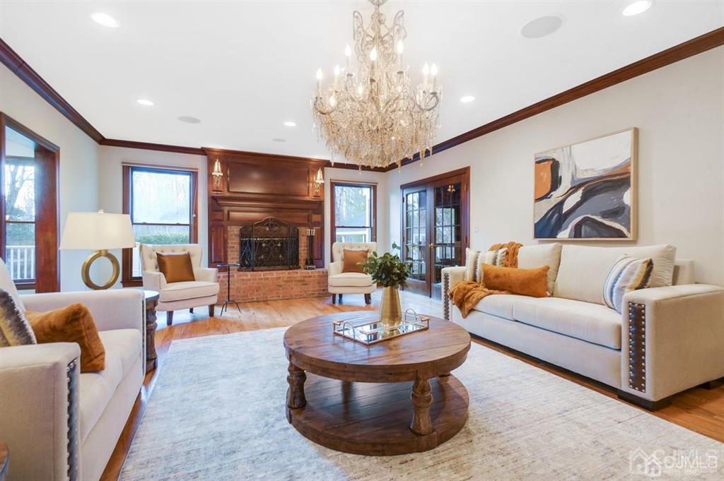 270 Springhill Road Skillman, NJ 08558 - Photo 10 of 27 a living room with fireplace furniture and a chandelier