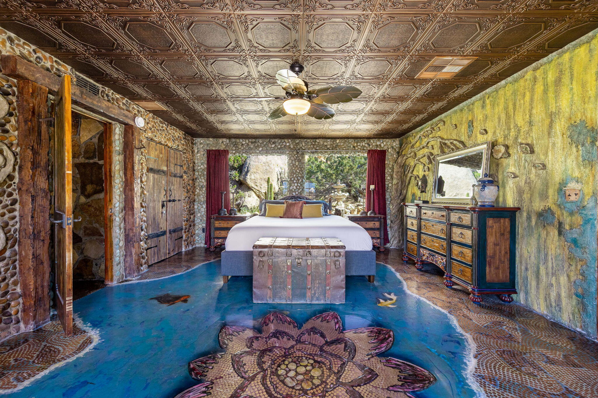 5845 Cholla Avenue Yucca Valley, CA 92284 - Photo 27 of 75 a living room with furniture and a floor to ceiling window