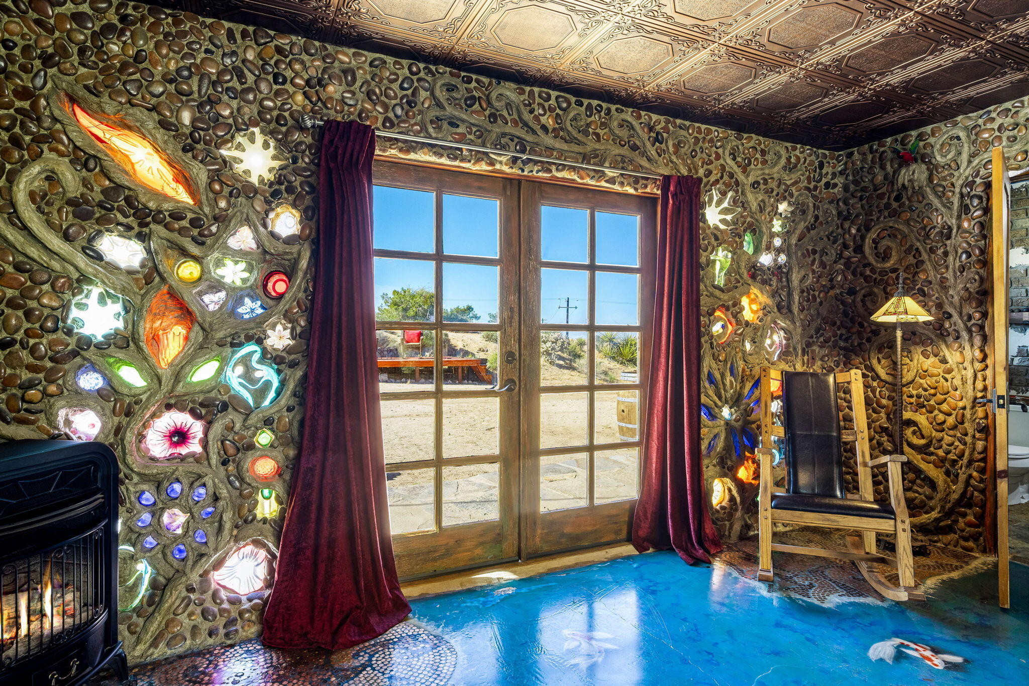 5845 Cholla Avenue Yucca Valley, CA 92284 - Photo 30 of 75 a living room with furniture and a window