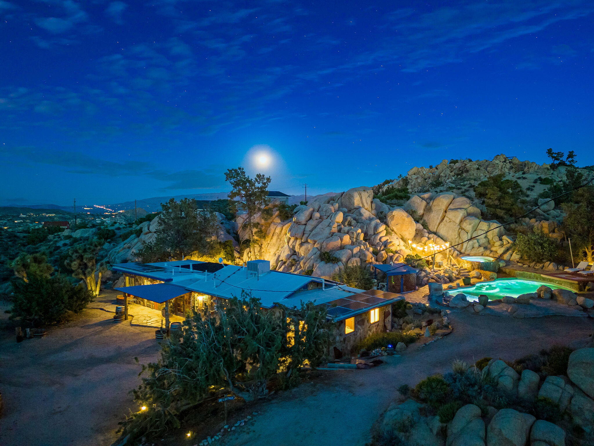 5845 Cholla Avenue Yucca Valley, CA 92284 - Photo 3 of 75 a view of a patio with table and chairs under an umbrella