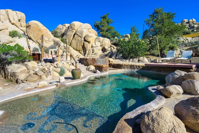 a view of a swimming pool with a patio