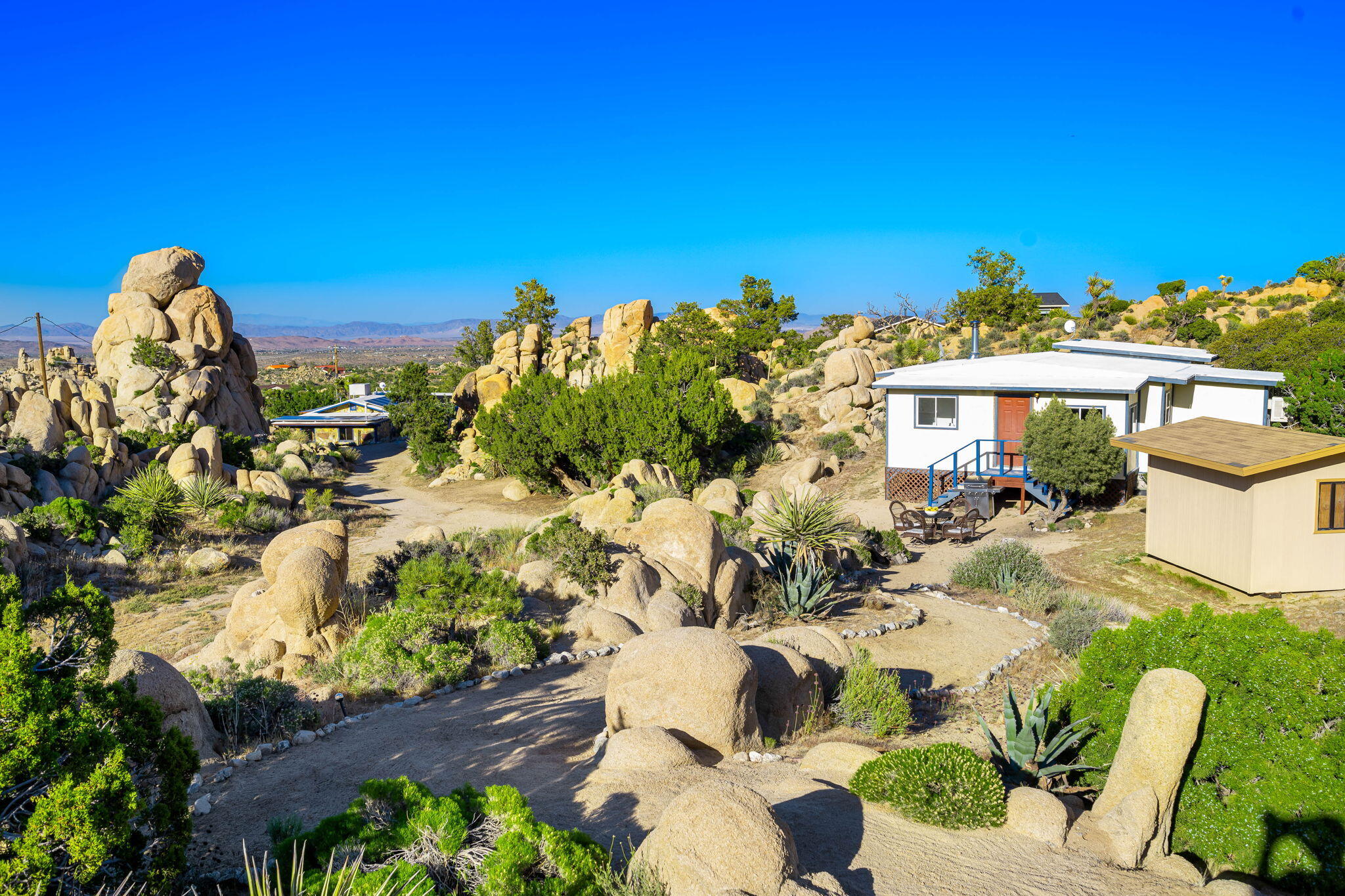5845 Cholla Avenue Yucca Valley, CA 92284 - Photo 46 of 75 a view of a swimming pool with a patio