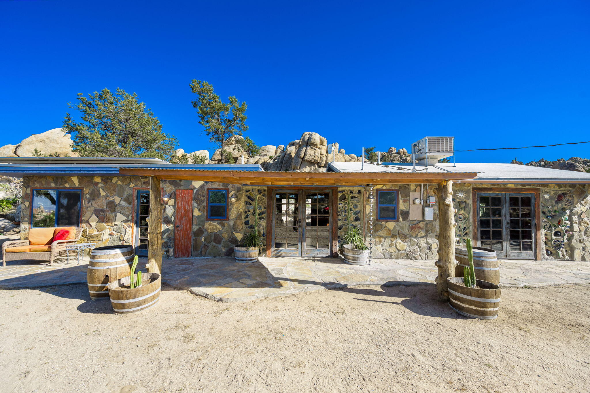 5845 Cholla Avenue Yucca Valley, CA 92284 - Photo 7 of 75 a view of a chairs and tables in patio