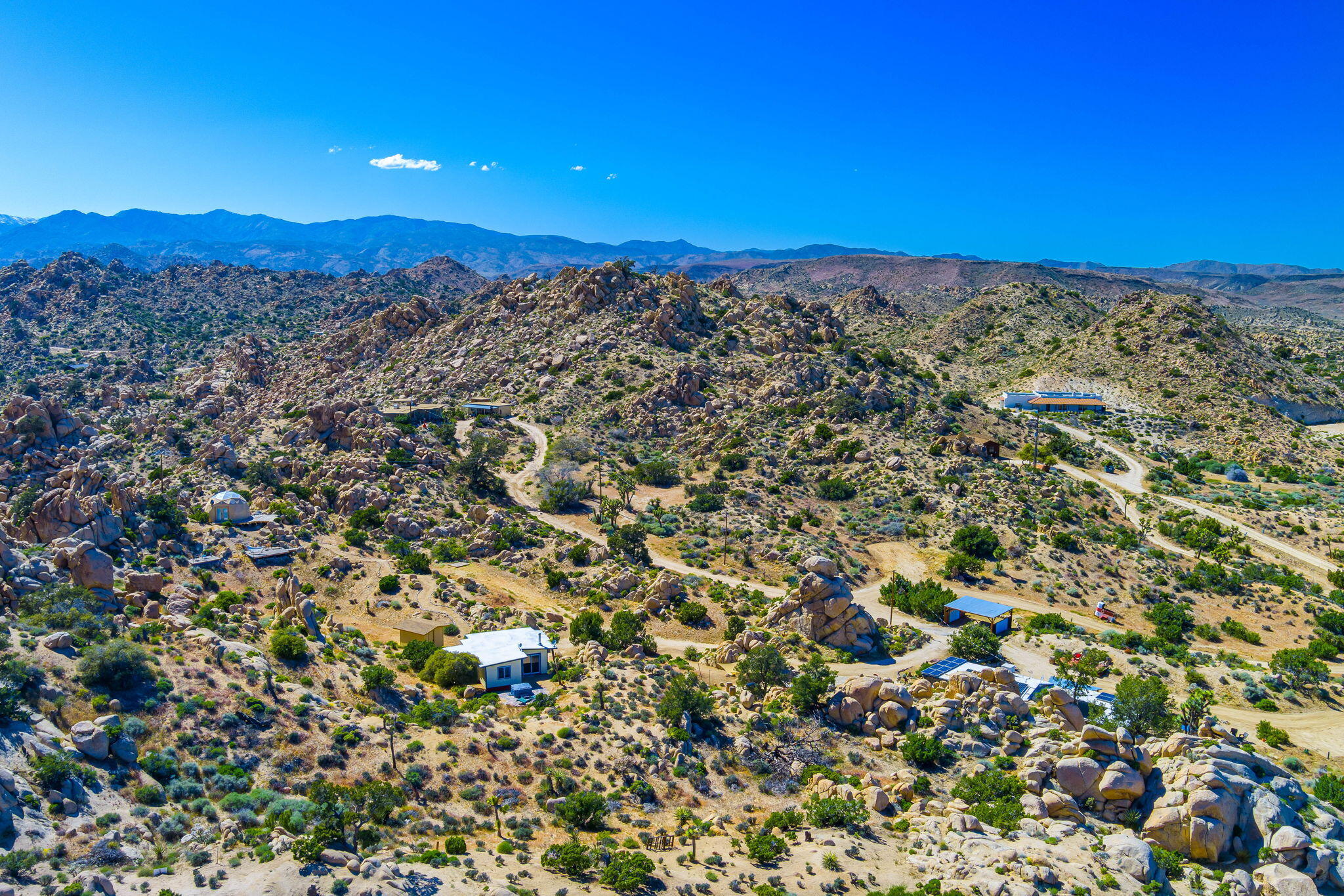 5845 Cholla Avenue Yucca Valley, CA 92284 - Photo 74 of 75 a view of a city with mountains in the background